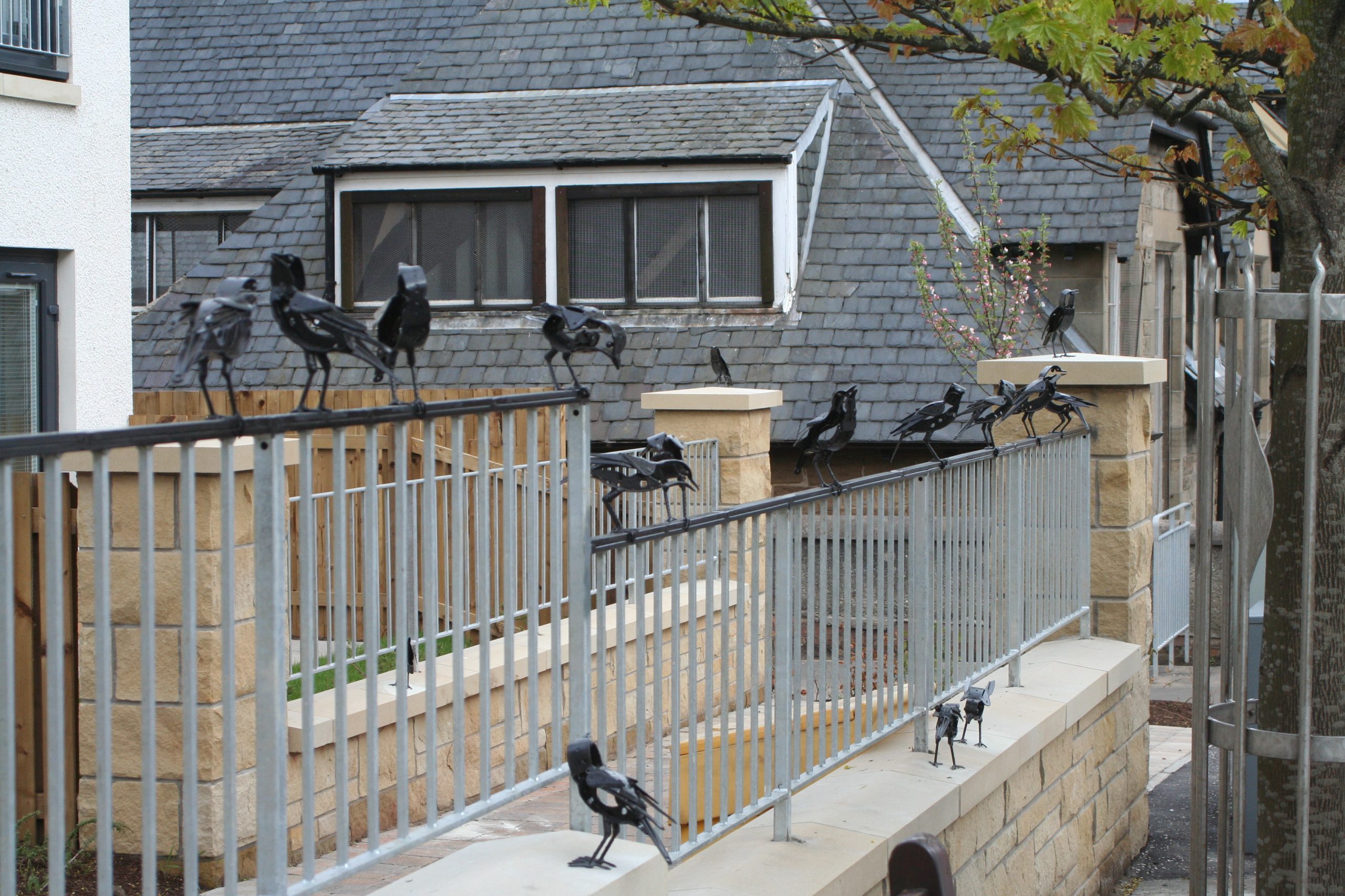 starling sculptures on railings